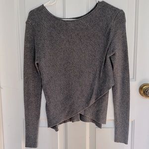 Grey sweater with a cross in the back